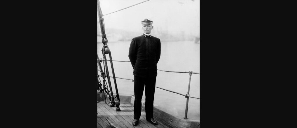 Ensign Chester W. Nimitz standing on the deck of a U.S. Navy training ship, circa 1907