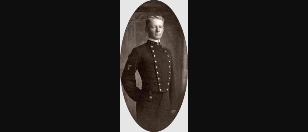 Sepia-toned portrait of a young Chester W. Nimitz in U.S. Naval Academy midshipman uniform, circa 1905